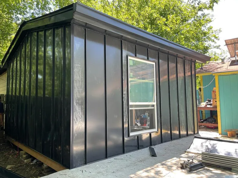 Black standing seam metal wall panels for Metal Roof Installation in Albertville